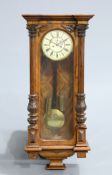 A LARGE 19TH CENTURY WALNUT VIENNA PATTERN WALL CLOCK, two-weight driven movement, the dial with