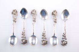 A SET OF SIX CONTINENTAL SILVER METAL COFFEE SPOONS, with moulded rose head handles, stamped '