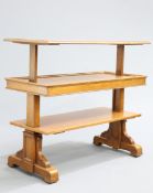 A 19TH CENTURY GILLOWS OAK METAMORPHIC DUMB WAITER, of three tiers, with trestle ends. 105.5cm high,