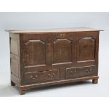 ~ AN OAK MULE CHEST, LATE 17TH/EARLY 18TH CENTURY, the moulded top above a front of three ogee