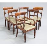 A MATCHED SET OF SIX REGENCY DINING CHAIRS, including a carver, each with reeded legs and drop-in