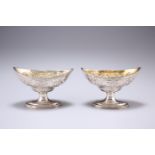 A PAIR OF GEORGE III SILVER PEDESTAL SALTS, by Peter, Anne & William Bateman, London 1803, navette