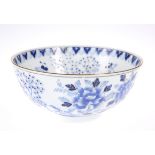 A CHINESE BLUE AND WHITE BOWL, circular, painted with foliage and butterflies. 15cm diameter