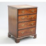 A GEORGE III STYLE MAHOGANY CHEST OF DRAWERS, of small proportions, the moulded rectangular top