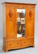 A LATE VICTORIAN SATINWOOD WARDROBE, with concave pediment over a central mirror door flanked by