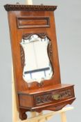 A VICTORIAN MAHOGANY WALL-HANGING MIRROR WITH GLOVE DRAWER. 39cm wide