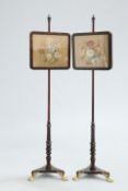 A PAIR OF VICTORIAN ROSEWOOD POLE SCREENS, each with floral needlework banner and brass hairy paw