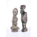 TRIBAL: TWO CARVED FIGURES, one of them modelled riding an animal