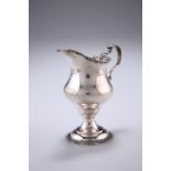 A GEORGE III SILVER CREAM JUG, by BM, London 1819, helmet formed with C-scroll handle and pedestal