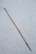 TRIBAL: A SPEAR, with barbed neck and arrow-shaped head. 157.5cm