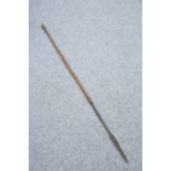 TRIBAL: A SPEAR, with barbed neck and arrow-shaped head. 157.5cm