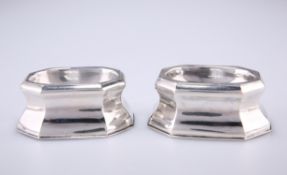 A PAIR OF GEORGE II SILVER TRENCHER SALTS, makers mark rubbed, London 1734, of octagonal canted