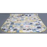 A PATCHWORK QUILT. 253cm by 212cm