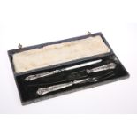A SILVER-HANDLED THREE-PIECE CARVING SET, various marks, cased.