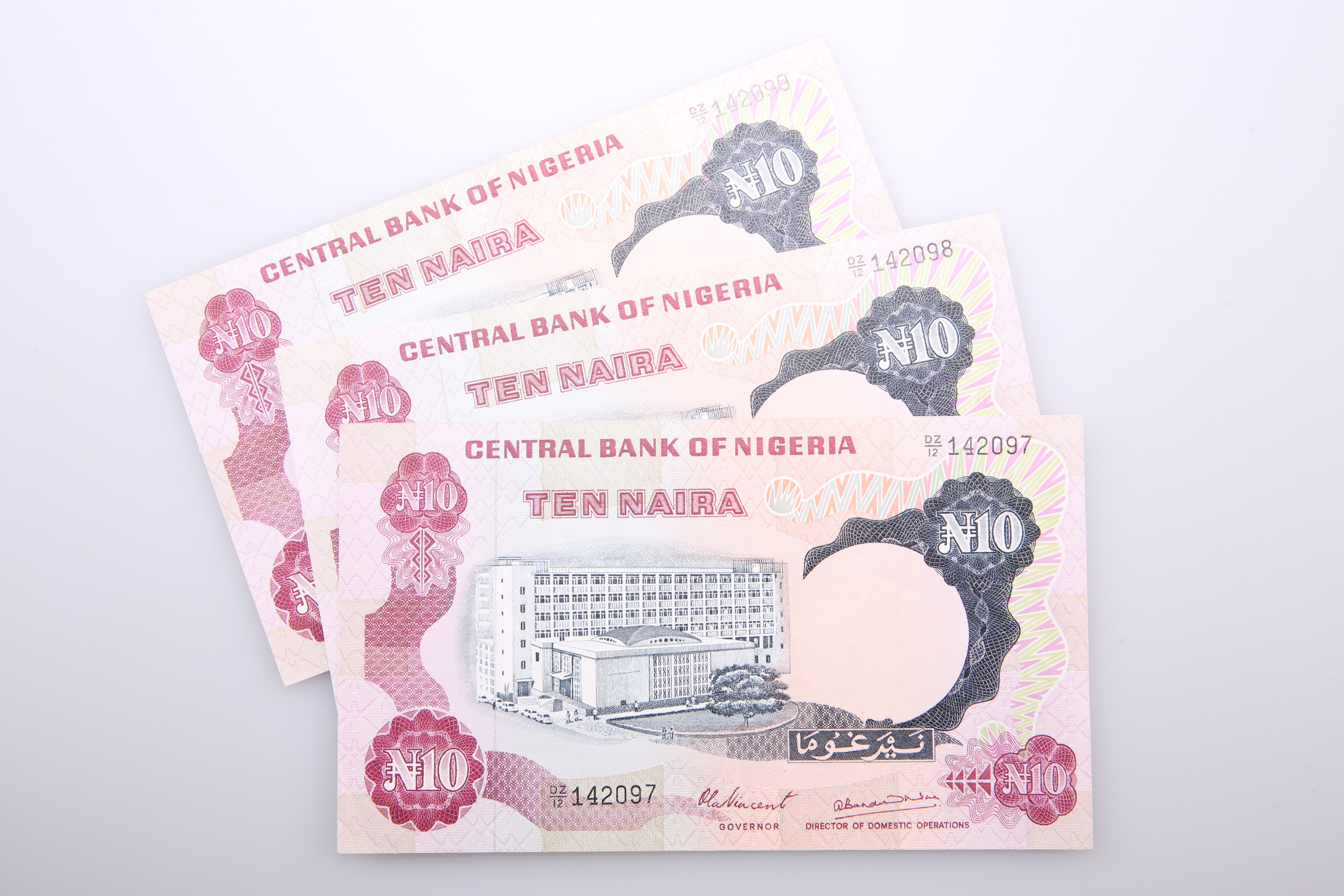 THREE NIGERIAN BANK NOTES, Central Bank of Nigeria, 10 Naira, 1973-78, DZ/12 142097-99, signature