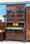 A GEORGE III MAHOGANY BUREAU BOOKCASE