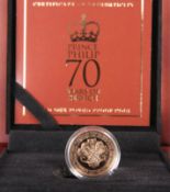 A GOLD ONE POUND PROOF COIN, "PRINCE PHILIP 70 YEARS OF SERVICE", boxed with certificate numbered