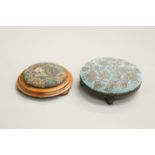 TWO VICTORIAN BEADWORK FOOTSTOOLS, each circular, the first ebonised and with gilt highlighting, the
