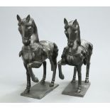A LARGE PAIR OF BRONZE HORSES, each cast saddled and with a raised front leg. 92cm high