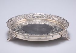 A CONTINENTAL SILVER BOTTLE COASTER, stamped 850 and S.P., of circular form with pierced berry