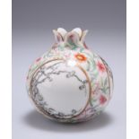 A CHINESE FAMILLE ROSE 'POMEGRANATE' VASE, decorated en grisaille to three circular reserves with