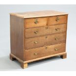 A GEORGE III OAK CHEST OF DRAWERS, the moulded rectangular top over two short over three long
