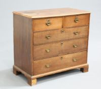 A GEORGE III OAK CHEST OF DRAWERS, the moulded rectangular top over two short over three long