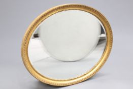 A LARGE 19TH CENTURY GILT-COMPOSITION OVAL MIRROR, with egg and dart moulded border. 87.5cm high,