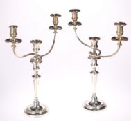 A PAIR OF MATTHEW BOULTON OLD SHEFFIELD PLATE THREE LIGHT CANDELABRA, CIRCA 1830, the tapering stems