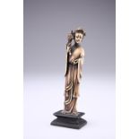 A CHINESE BONE FIGURE OF AN IMMORTAL, LATE 19TH CENTURY, carved standing in voluminous robes and