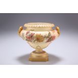 A ROYAL WORCESTER BLUSH IVORY VASE, of urn-form with twin handles, painted with flowers, shape no.
