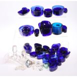 A LARGE QUANTITY OF PREDOMINANTLY BLUE GLASS LINERS, various shaped and sizes.