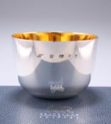 A CONTEMPORARY SILVER TUMBLER, by Braybrook & Britten, London 2007, of typical form with silver gilt