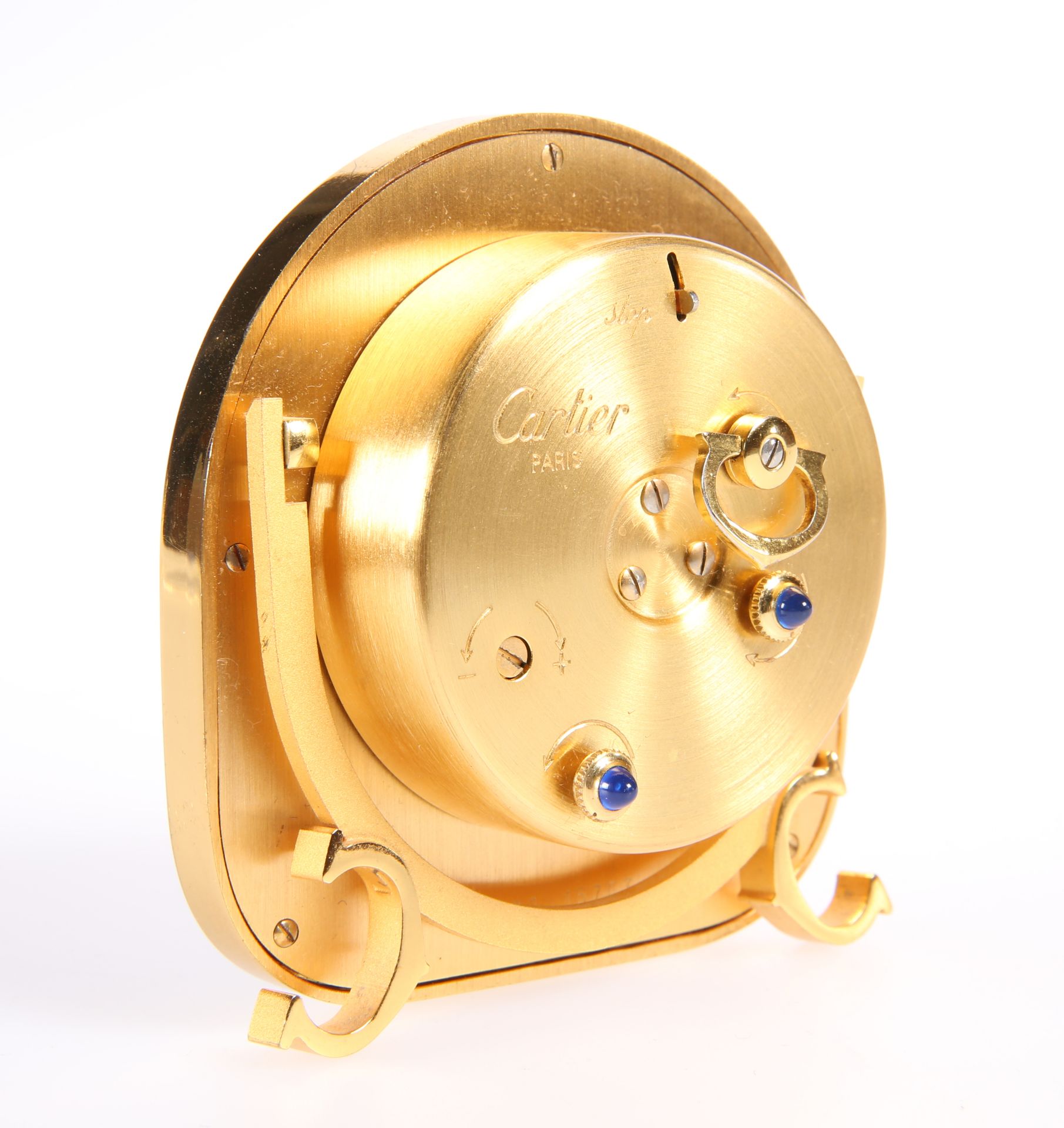 A CARTIER YELLOW-METAL STRUT CLOCK, the arch-top case housing a circular white dial, signed 'Cartier - Image 3 of 3
