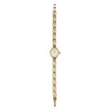 A LADY'S 9CT GOLD ACCURIST BRACELET WATCH,