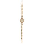 A LADY'S 9CT GOLD PEERTONE BRACELET WATCH,