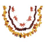 TWO AMBER NECKLACES AND A CORAL NECKLACE