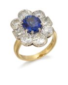 AN 18CT SAPPHIRE AND DIAMOND CLUSTER RING,