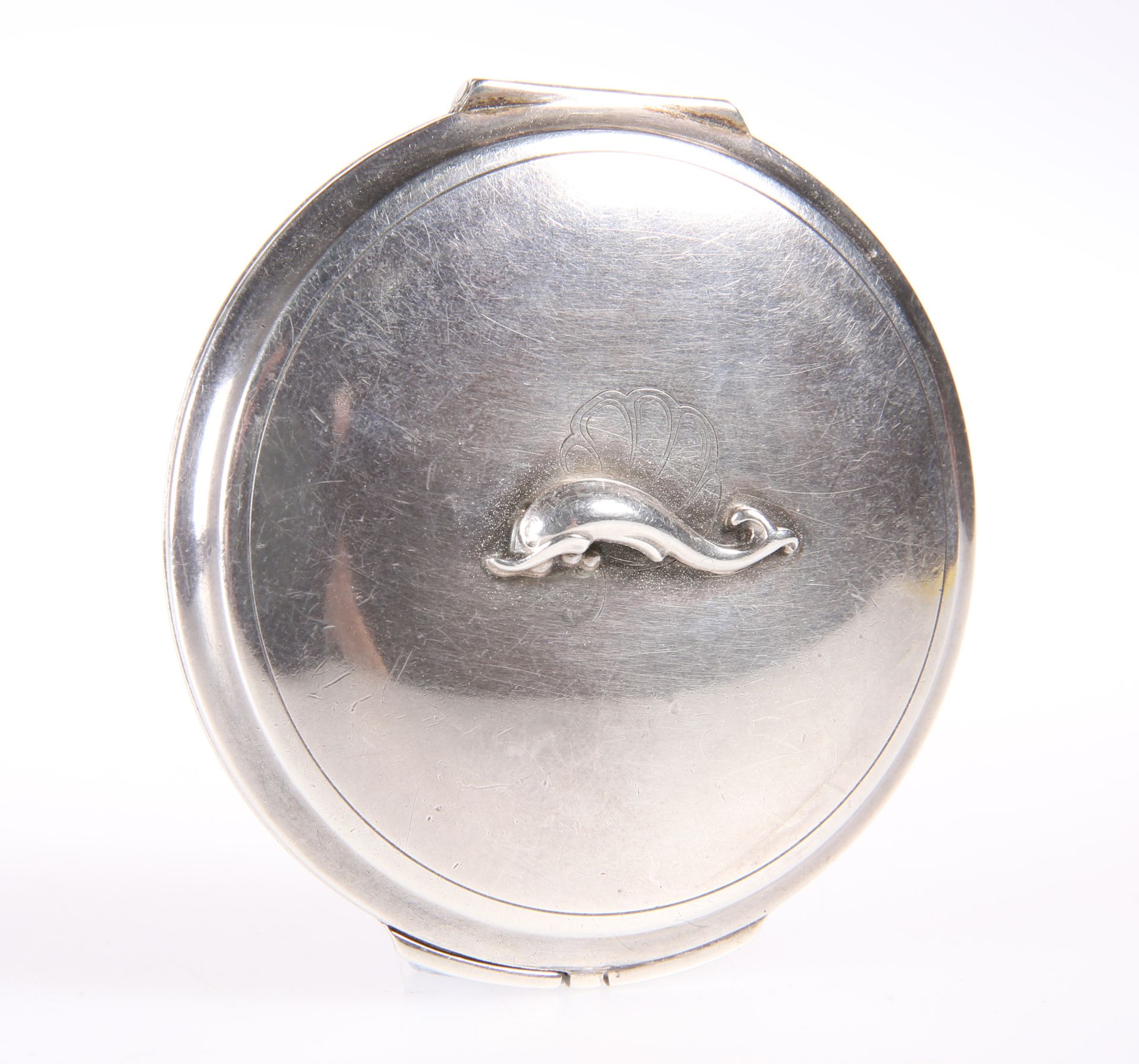 GEORG JENSEN, A SILVER POWDER COMPACT, embellished with a dolphin on the lid, with mirror and pink