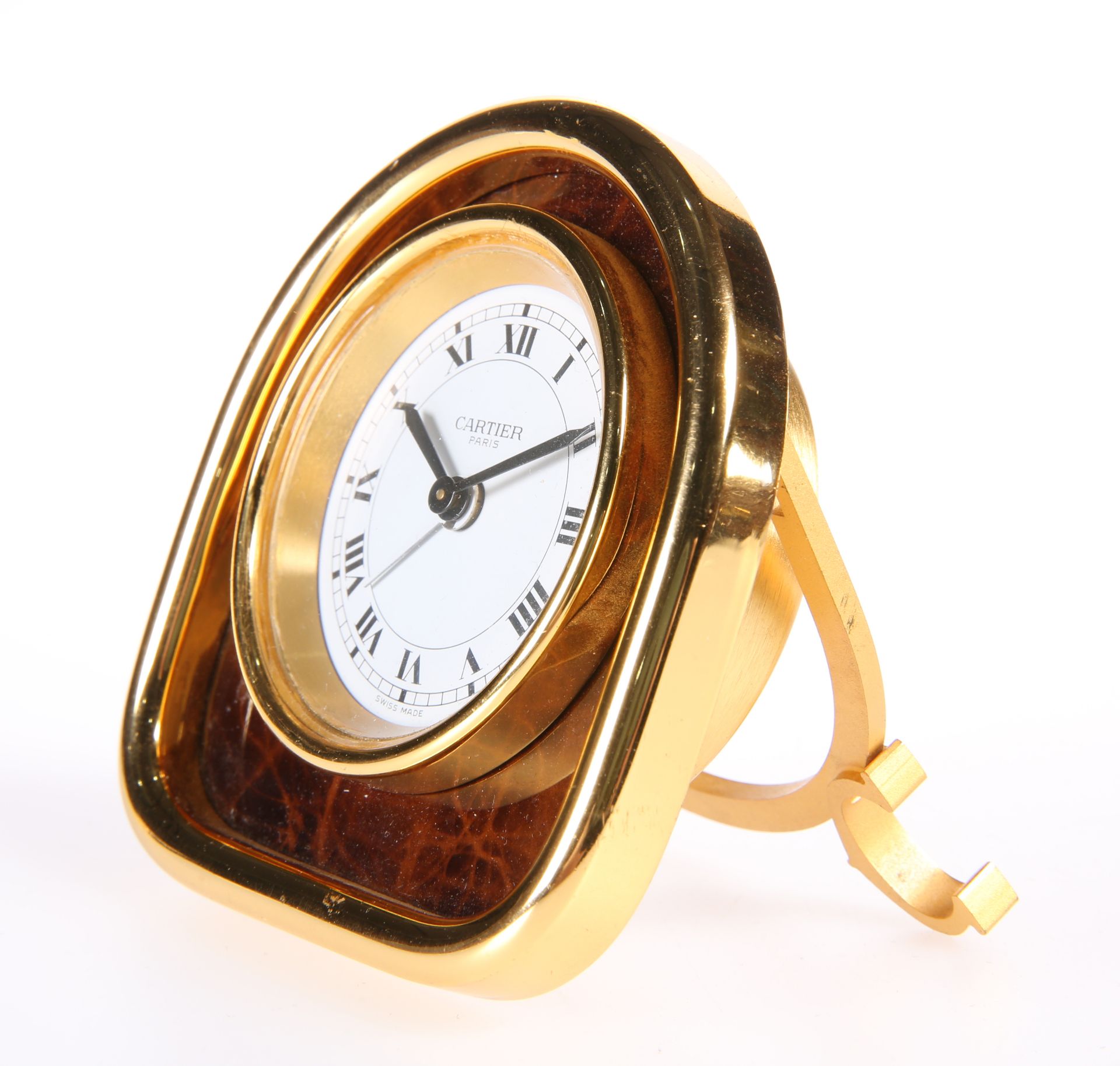 A CARTIER YELLOW-METAL STRUT CLOCK, the arch-top case housing a circular white dial, signed 'Cartier - Image 2 of 3