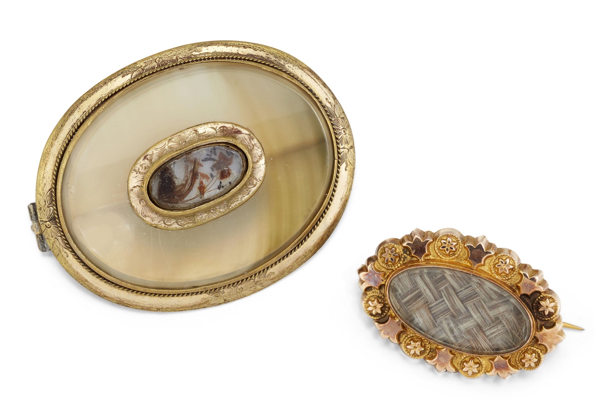 A 9CT HAIRWORK BROOCH AND A CHALCEDONY MEMORIAL BROOCH,