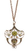 AN EDWARDIAN 9 CARAT GOLD, PERIDOT AND SEED PEARL PENDANT NECKLACE, on a chain stamped '9ct'.