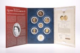 A LONDON MINT QUEEN ELIZABETH II SEVEN COIN SET, including The Queen's 90th Birthday Gold Coin (9