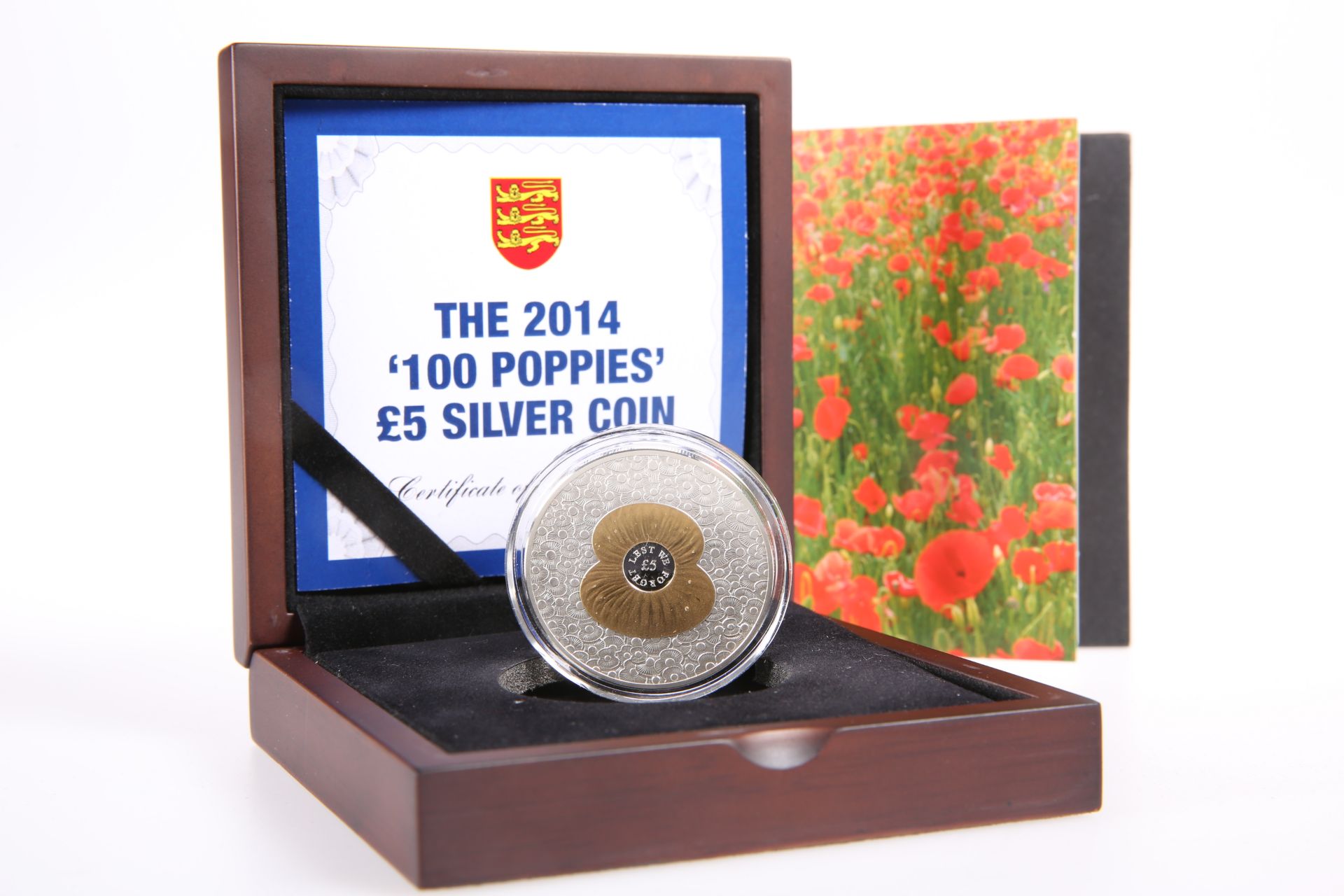 A 2014 '100 POPPIES' £5 SILVER COIN, boxed with COA