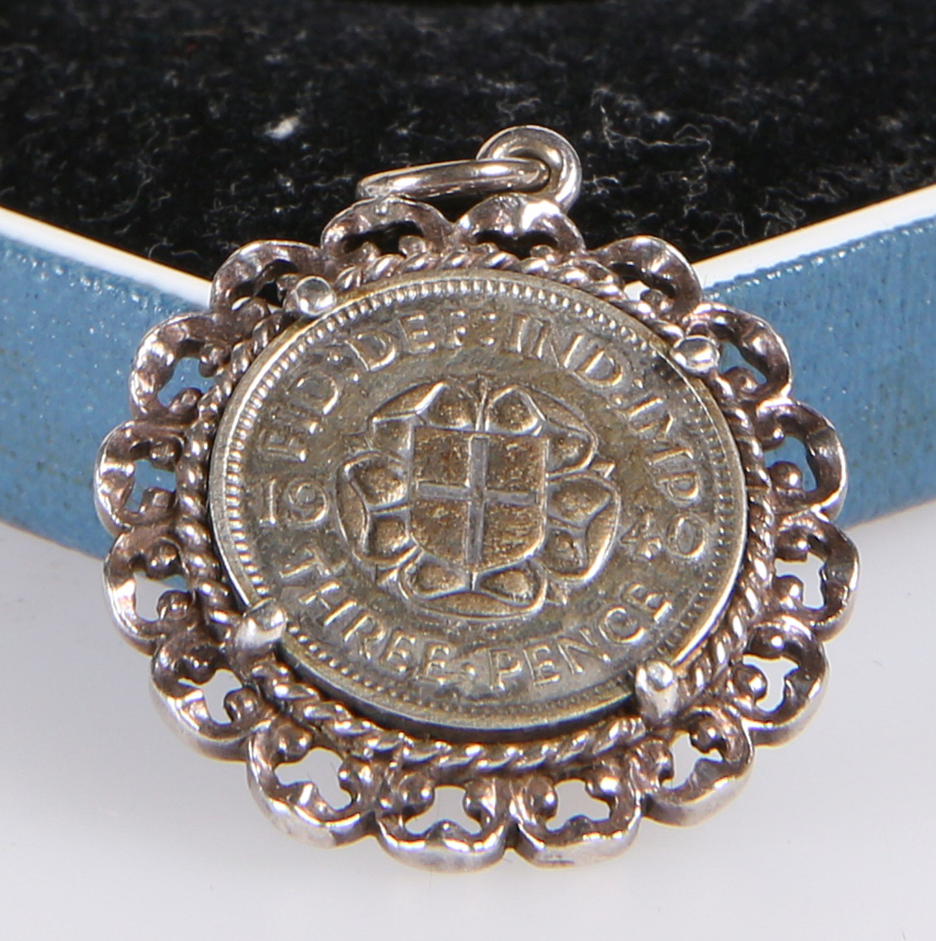 A GEORGE VI SILVER THREE-PENCE BIT, in pendant mount