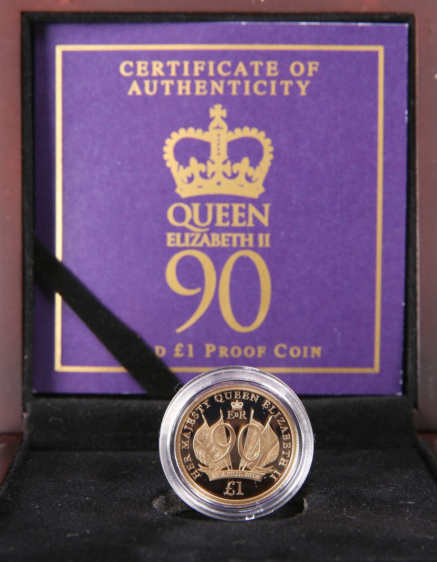 A 2016 GOLD PROOF ONE POUND COIN, "HER MAJESTY THE QUEEN'S 90TH BIRTHDAY", no. 994, boxed with