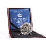 A SAPPHIRE JUBILEE SILVER FIVE POUNDS PROOF COIN WITH GENUINE SAPPHIRE, boxed with COA no. 1224