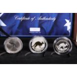 A 2017 AUSTRALIAN SILVER KANGAROO NUMISMATIC SET, the three coins boxed with COA