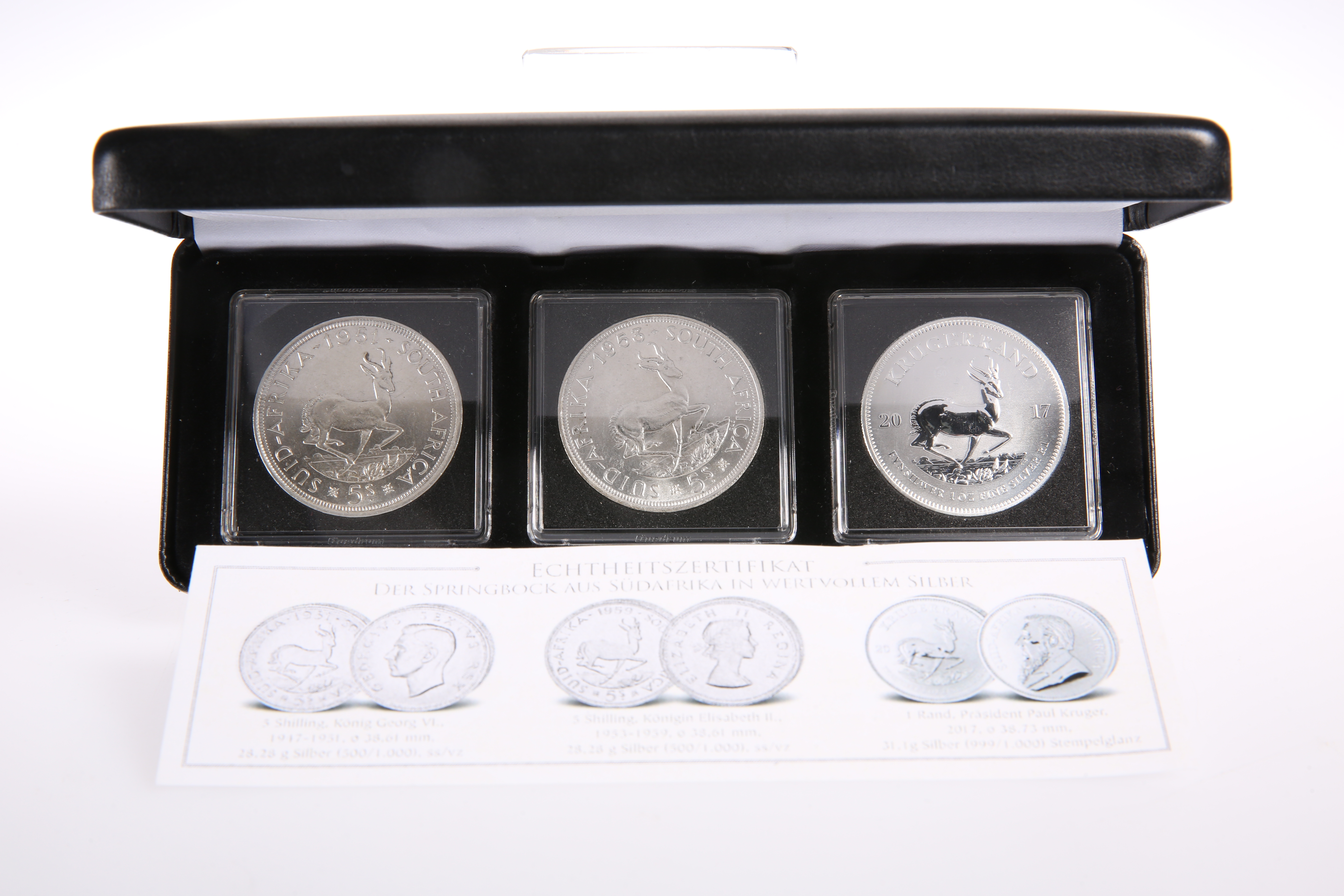 A SET OF THREE "KRUGERRAND" SILVER COINS, boxed with papers
