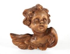 Anonymer Holzbildhauer20. Jh..Putto.Vollrund geschnitzt, braune Patina. H 15,5 cm. € 15